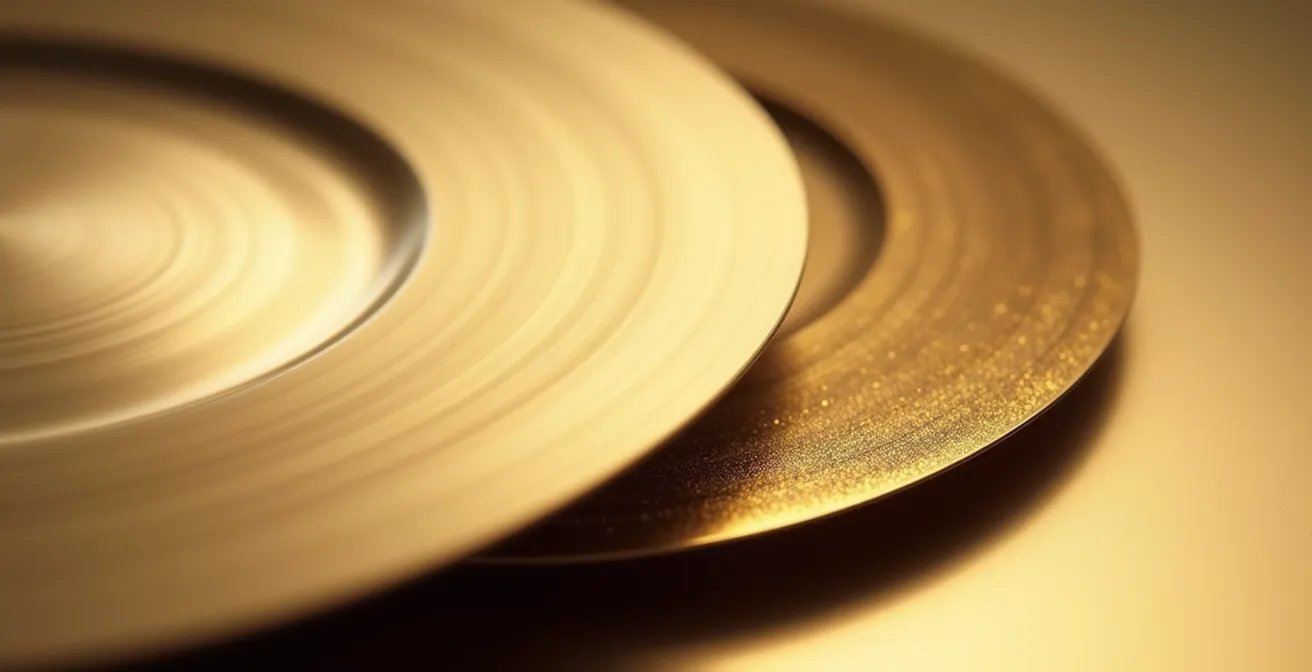 Close-up comparison of brushed gold versus polished gold charger plates showing light reflection differences